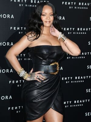 Rihanna sexy in leather mini dress in Milan to launch her beauty line